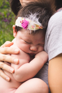 Baby Girl Snuggled closely into mama Greenville SC Newborn pictures