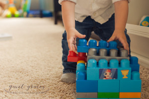 Baby playing with Mega Blocks