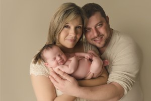 Smiling Newborn with Family Greenville SC