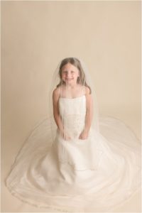 Little girl in Mommy's Wedding Dress Pictures in Greenville SC