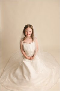 Little girl in Mommy's Wedding Dress Pictures in Simpsonville SC