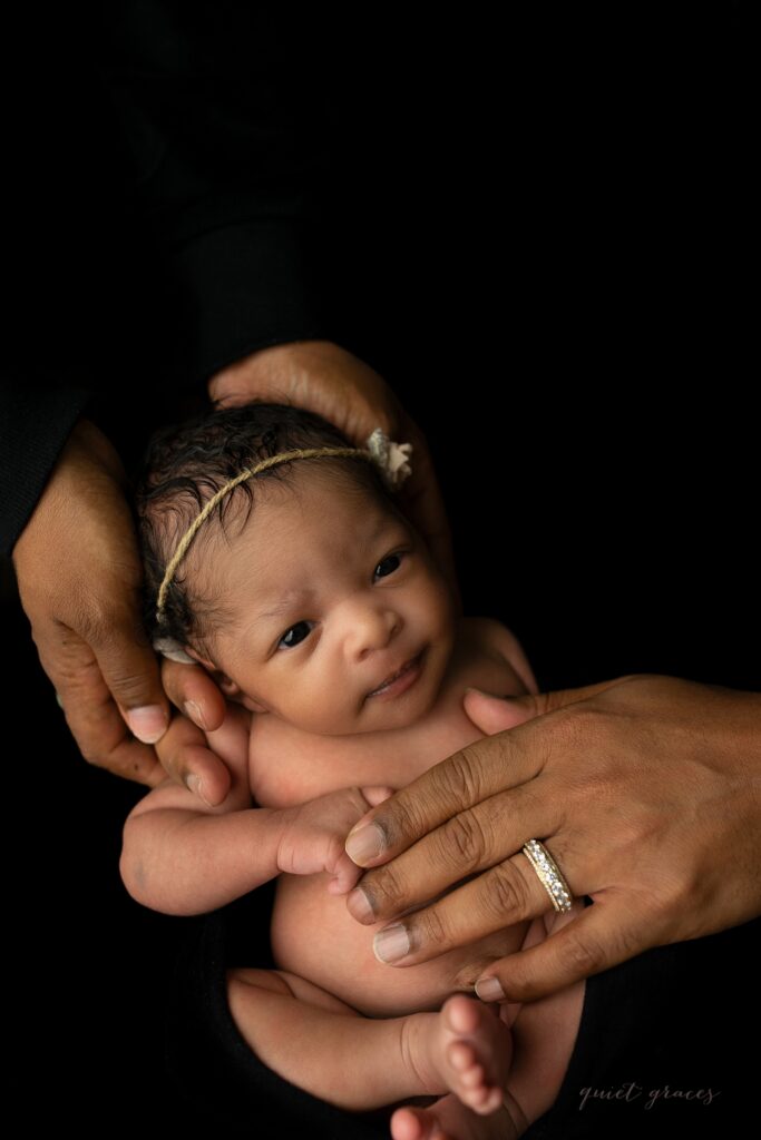 Greer SC Newborn Photos Baby Awake in Parents hands